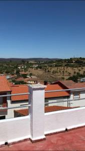 a view of a white building with red roofs at CASA LATY in La Fregeneda
