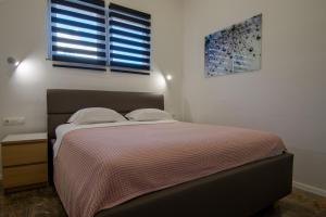 Posteľ alebo postele v izbe v ubytovaní Apartments Lantina