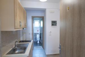 Kuchyň nebo kuchyňský kout v ubytování Hotel Villa Adrian