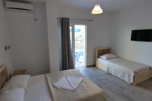 Postel nebo postele na pokoji v ubytování Hotel Villa Adrian