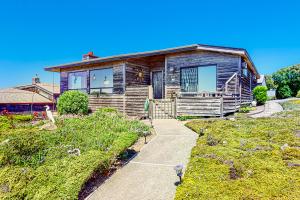 a wooden house with a pathway in front of it at Pinnacle Heights in Bodega Bay