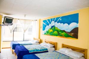 Tempat tidur dalam kamar di La Posada Del Viajero