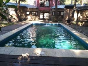 Swimmingpoolen hos eller tæt på Cabañas El Secreto + 19 billeder