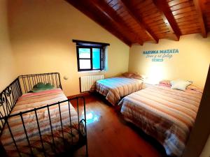 Postel nebo postele na pokoji v ubytování La Escondida