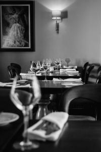 a black and white photo of a table with wine glasses at The Boot Inn in Burton upon Trent