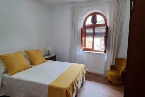 Ένα ή περισσότερα κρεβάτια σε δωμάτιο στο Casa Pedra de Roder
