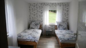 Postel nebo postele na pokoji v ubytování Modernisierte Ferienwohnung im schönen Sauerland