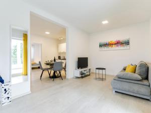 a living room with a couch and a table at Apartment Aria in Poreč