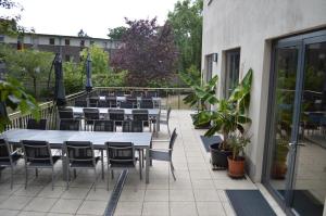 a group of tables and chairs on a patio at Jugendherberge Potsdam in Potsdam