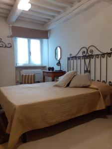 a bedroom with a large bed in a room at Una finestra sul mare - Appartamento a Fano in Fano