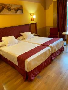 Postel nebo postele na pokoji v ubytování Hotel Fuente Las Piedras + 23 fotografií