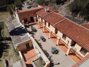 an overhead view of a house with red roofs at Hosteria la granja in Huacalera