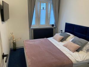 Posteľ alebo postele v izbe v ubytovaní Apartamenty Planeta