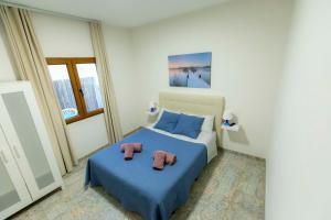 Posteľ alebo postele v izbe v ubytovaní Casa Estrella y Casa Carmen