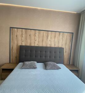 Postel nebo postele na pokoji v ubytování Lokal apartment