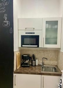 Kuchyň nebo kuchyňský kout v ubytování Lokal apartment