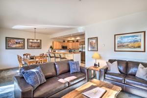 a living room with a couch and a table at Breckenridge Condo with Hot Tub Less Than 1 Mi to Ski Lifts in Breckenridge