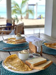 a table with a plate of bread and toast at Casa Greca in Playa Blanca