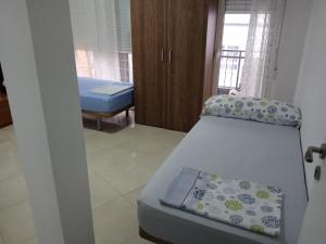 Een bed of bedden in een kamer bij pension mexico