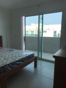 Cama ou camas em um quarto em Lebon Vivant cobertura vista mar