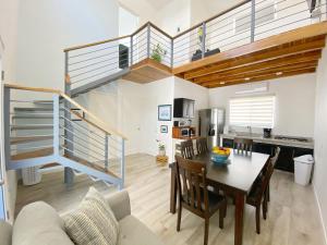 a kitchen and dining room with a staircase in a house at Nicoya Villas in Mal País