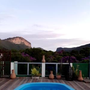 a patio with a view of the mountains at Vyzuh Guest House in Vale do Capao