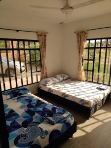 A bed or beds in a room at Casa Vacacional Quinta Sofia