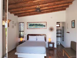 A bed or beds in a room at Punta del Norte Bungalows