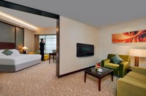 Postel nebo postele na pokoji v ubytování Eastin Hotel Kuala Lumpur