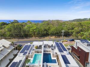 an aerial view of a building with a swimming pool at Driftwood Two at Clarkes Beach in Byron Bay