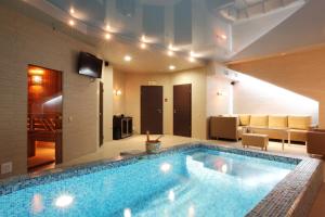 a large swimming pool in a living room at AVANTA hotel-center in Novosibirsk