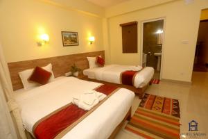 Uma cama ou camas num quarto em Hotel Sadan