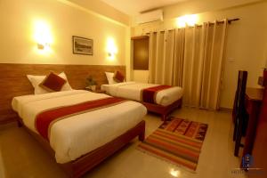 Uma cama ou camas num quarto em Hotel Sadan