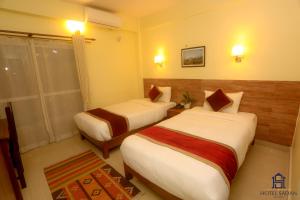 Uma cama ou camas num quarto em Hotel Sadan