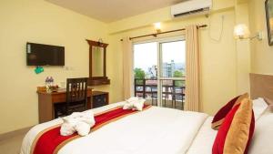 Uma cama ou camas num quarto em Hotel Sadan
