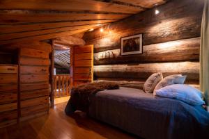 Säng eller sängar i ett rum på Saaruantähti Cottage