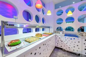 a buffet line with desserts on display at River Rock Hotel in Ayia Napa