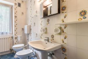 a bathroom with a sink and a toilet at Casa Vacanza Zambotti in Vermiglio +53 photos