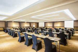 a large room with tables and chairs in it at Grand Rohan Jogja in Yogyakarta +71 photos