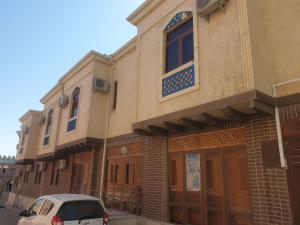 a car parked in front of a building at MELODIA Guest House in Bukhara
