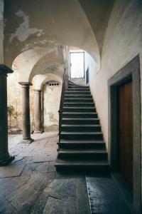 a staircase in an old building with a stair case at Beautiful View in Bergamo
