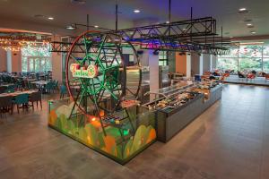 a large exhibit in a restaurant with a roller coaster at Bangi Resort Hotel in Bangi