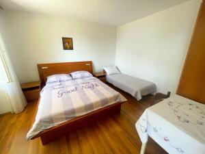 Postel nebo postele na pokoji v ubytování Apartman Renči