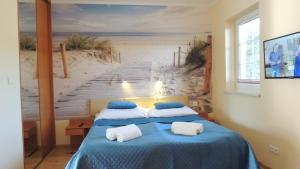 Ένα ή περισσότερα κρεβάτια σε δωμάτιο στο EUROPA APARTAMENTY +48 φωτογραφίες