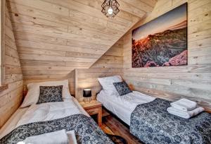 Tempat tidur dalam kamar di Domek Regionalny Baligówka