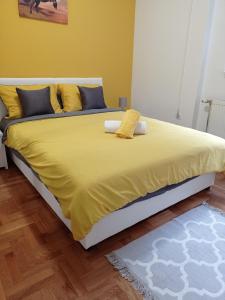 Postel nebo postele na pokoji v ubytování APARTMAN SUNFLOWER