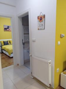 Postel nebo postele na pokoji v ubytování APARTMAN SUNFLOWER
