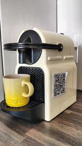 a toaster with a cup on top of it at Relax,Revive,Reset & enjoy the sounds of the sea! in Cape Town