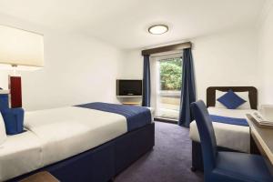 Postel nebo postele na pokoji v ubytování Ramada Oxford