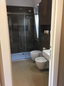 a bathroom with a shower and a toilet and a sink at La Dimora di Clara in Monterosso al Mare +26 photos